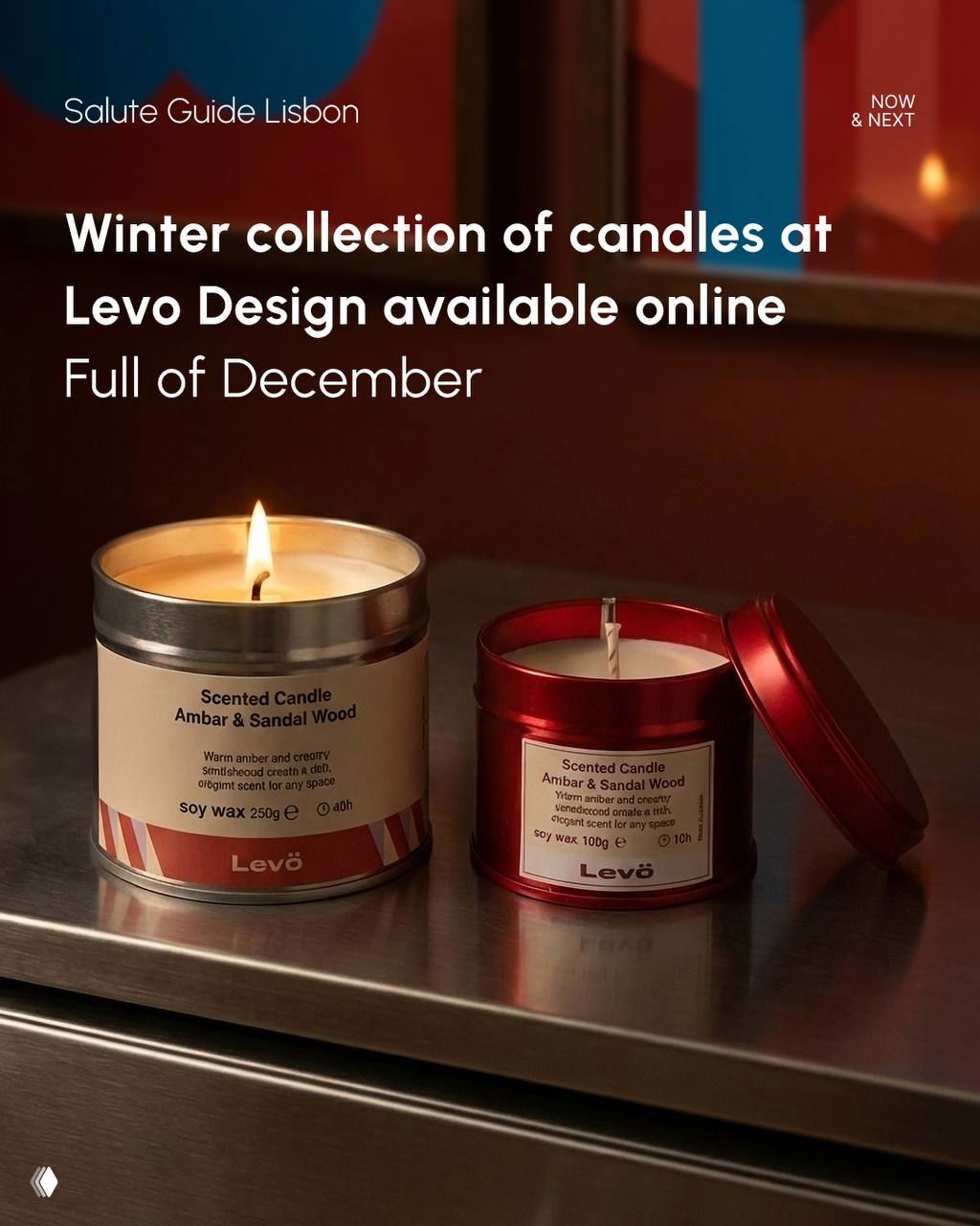 Two scented candles on a metal surface photographed for a winter collection display, warm tones and soft reflections emphasising product detail.